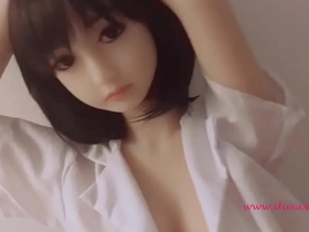Zara, a slender sex doll with a shaved pussy, enjoys pleasuring herself