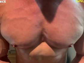 Hunky Asian man with chiseled abs and pecs gets oiled up for some nipple play